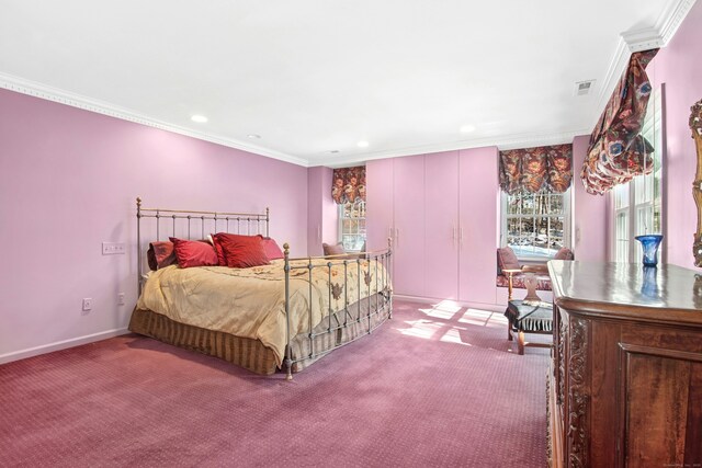 bedroom with ornamental molding, carpet, visible vents, and baseboards