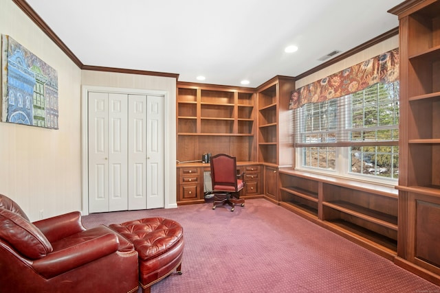 carpeted office featuring crown molding, visible vents, built in desk, and recessed lighting