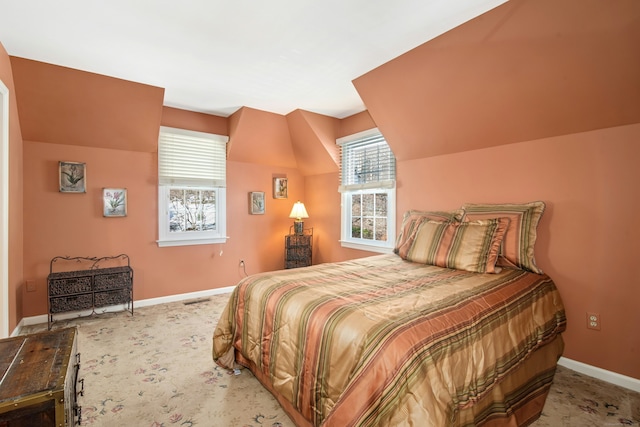 bedroom with carpet floors, visible vents, and baseboards