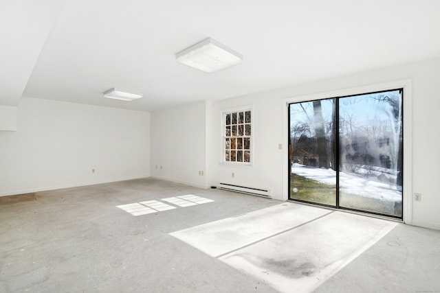 empty room with a baseboard radiator, baseboards, and unfinished concrete flooring