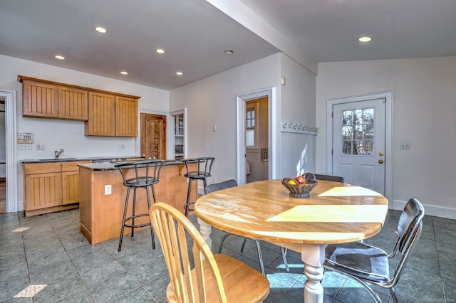 dining space featuring baseboards, light tile patterned flooring, and recessed lighting