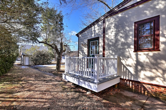 view of side of home with a deck