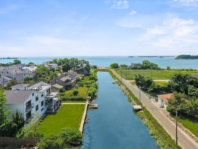 birds eye view of property with a water view and a residential view