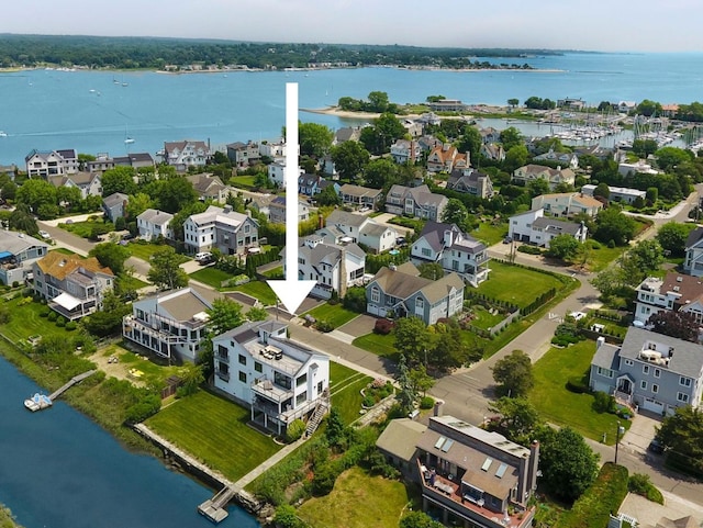 birds eye view of property featuring a water view and a residential view