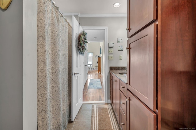 bathroom featuring ornamental molding, tile patterned flooring, vanity, and recessed lighting