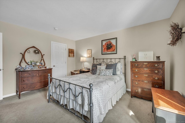 carpeted bedroom featuring baseboards