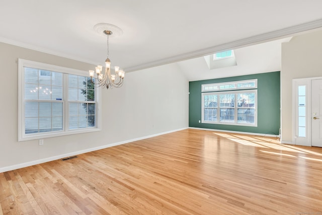 unfurnished room with light wood-style floors, baseboards, visible vents, and crown molding