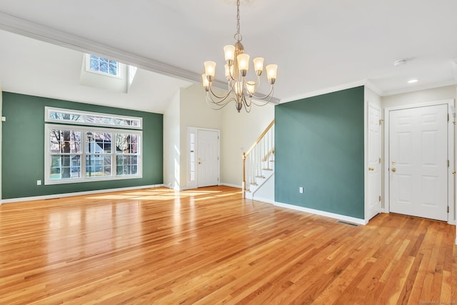 unfurnished living room with light wood finished floors, visible vents, baseboards, stairs, and crown molding