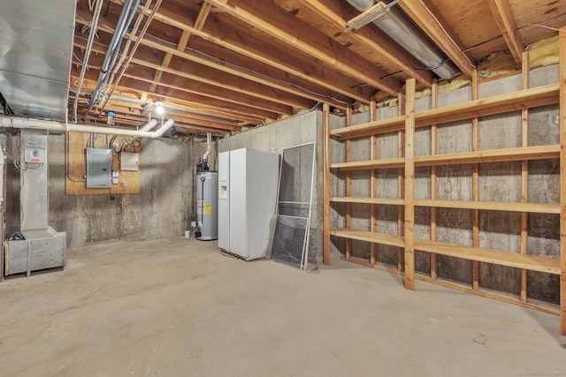 unfinished below grade area featuring gas water heater, electric panel, and heating unit