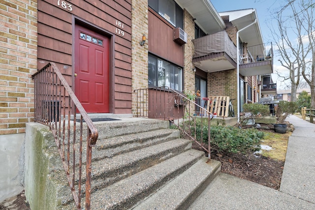 entrance to property with brick siding