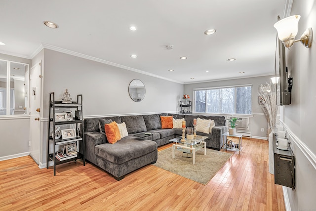 living area with baseboards, ornamental molding, light wood-type flooring, and recessed lighting