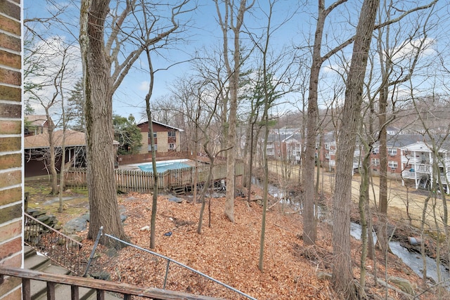 view of yard featuring a fenced in pool