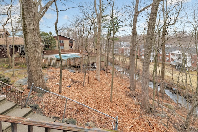 view of yard with a community pool