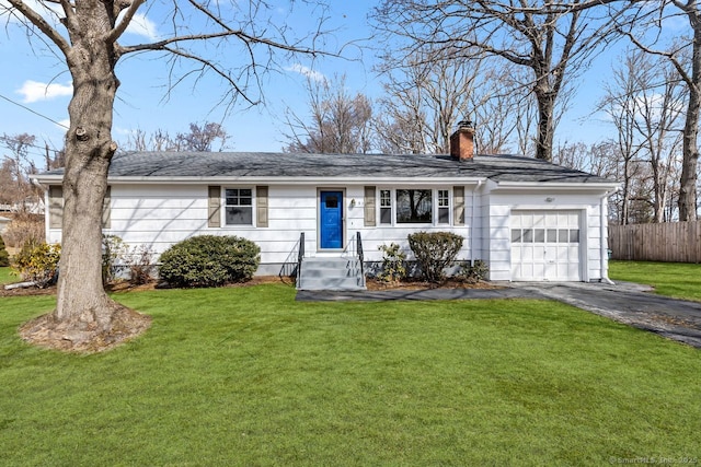 ranch-style house with a garage, driveway, a front yard, and fence