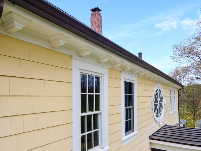 view of home's exterior with a chimney