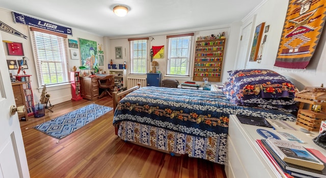 bedroom with wood finished floors