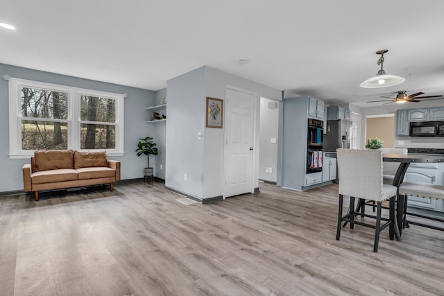 interior space featuring light wood finished floors and baseboards