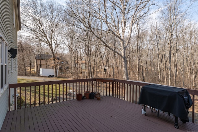 wooden terrace featuring grilling area