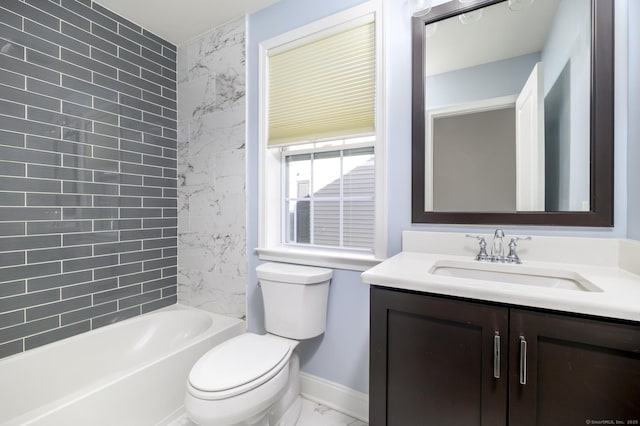 bathroom with toilet, marble finish floor,  shower combination, baseboards, and vanity