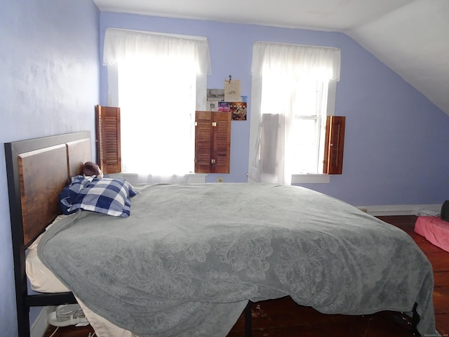 bedroom featuring lofted ceiling