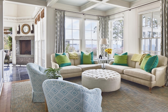 sunroom / solarium with beamed ceiling, a fireplace, and coffered ceiling