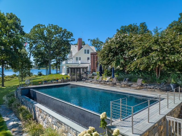 outdoor pool featuring a patio