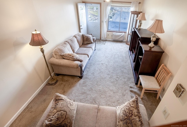 living room featuring carpet floors, visible vents, and baseboards