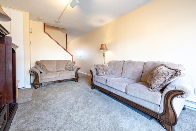 carpeted living room with baseboards