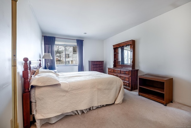 bedroom with light colored carpet