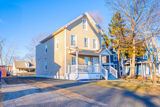 traditional home featuring covered porch