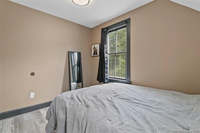 bedroom featuring baseboards