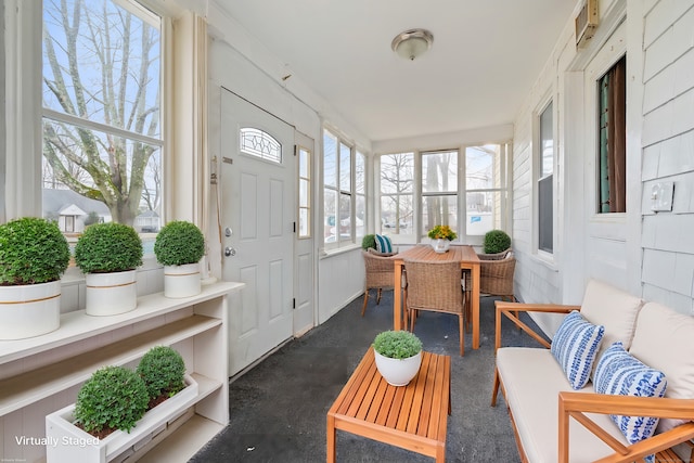 sunroom featuring finished concrete flooring