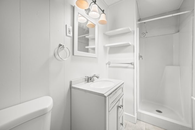 full bathroom featuring a shower stall, tile patterned flooring, vanity, and toilet