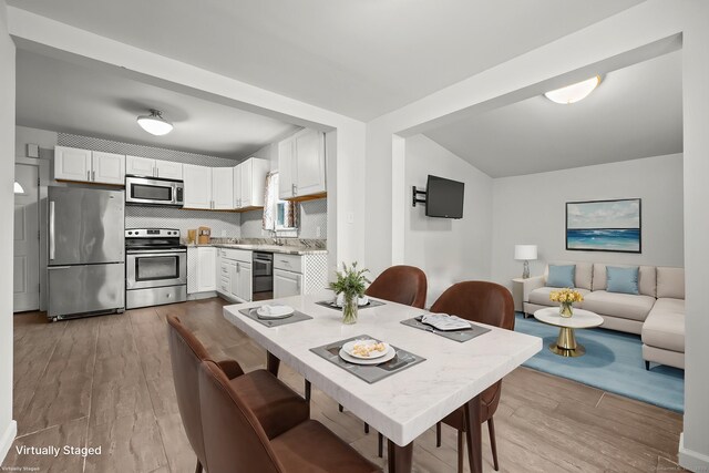dining area featuring wood finished floors