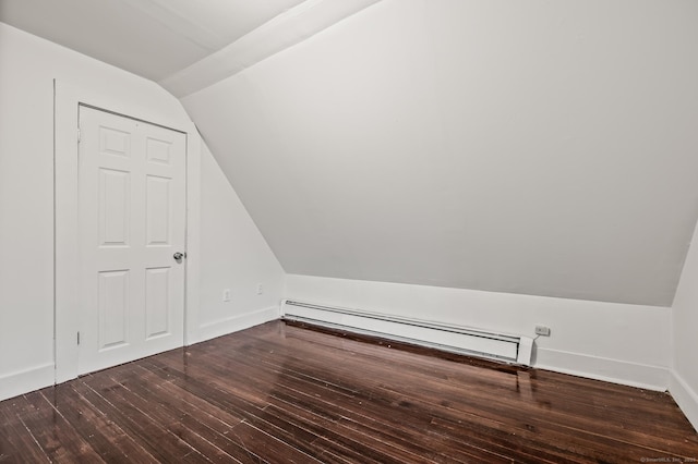 additional living space featuring hardwood / wood-style flooring, a baseboard heating unit, baseboards, and lofted ceiling