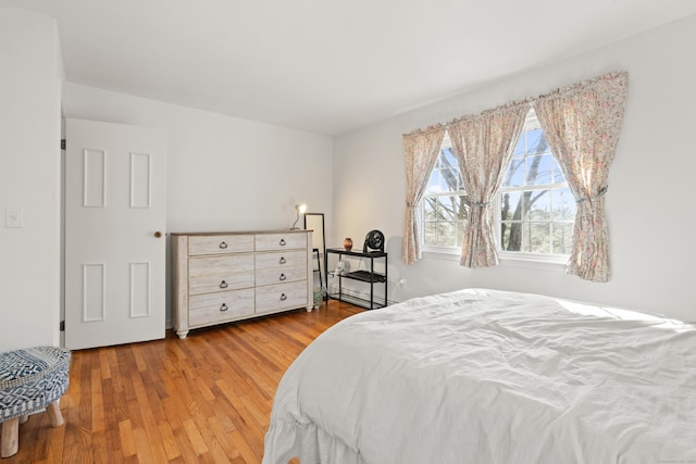 bedroom with wood finished floors