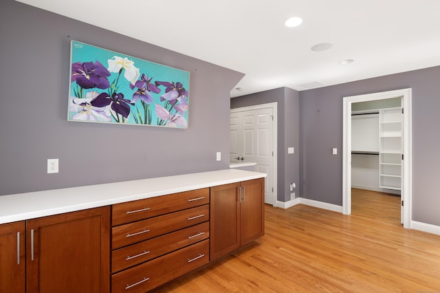 interior space with recessed lighting, baseboards, and light wood-style floors