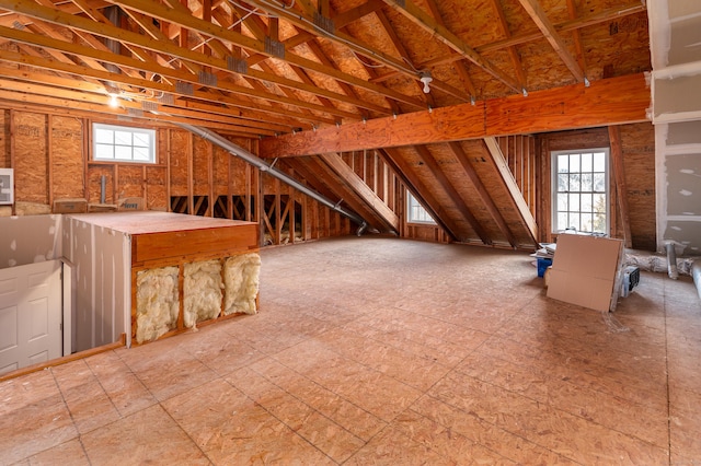 unfinished attic featuring a wealth of natural light