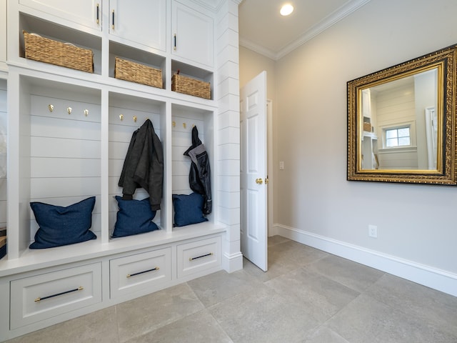 mudroom featuring baseboards, ornamental molding, and recessed lighting