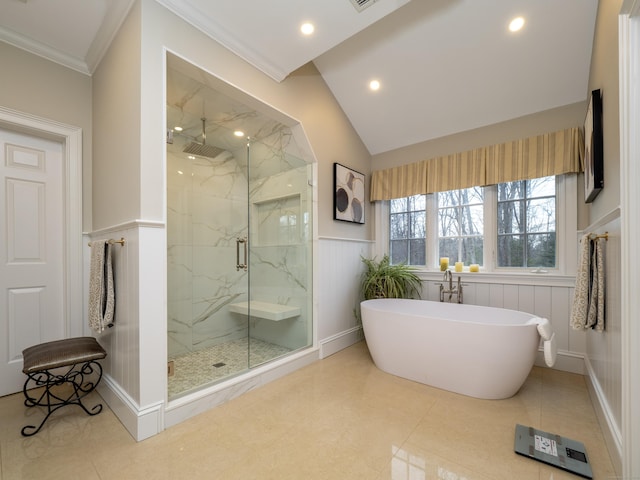 full bathroom featuring a marble finish shower, wainscoting, crown molding, a freestanding bath, and recessed lighting