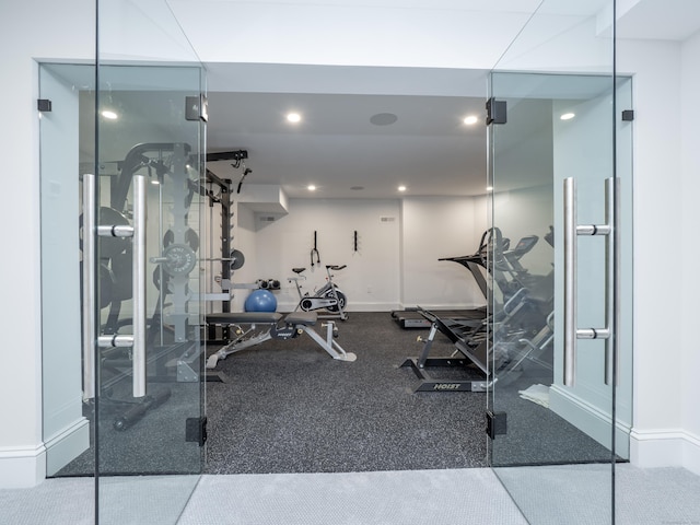 exercise room featuring recessed lighting and baseboards