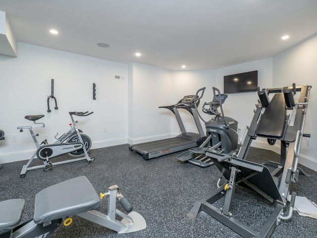 exercise area with recessed lighting, visible vents, and baseboards