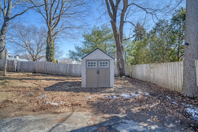 view of shed featuring a fenced backyard