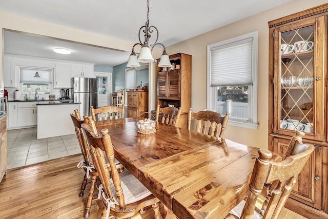 dining area with light wood-style floors