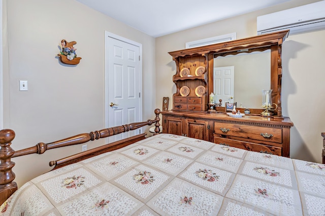 bedroom with a wall mounted AC