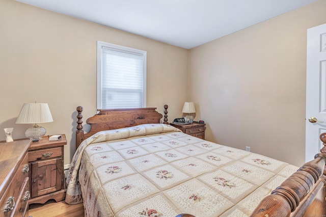 bedroom featuring wood finished floors