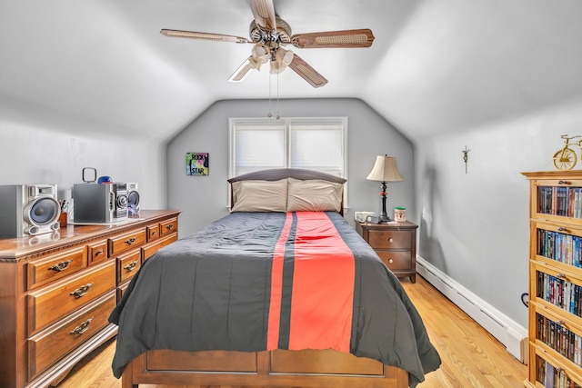 bedroom featuring baseboards, ceiling fan, vaulted ceiling, baseboard heating, and light wood-style floors