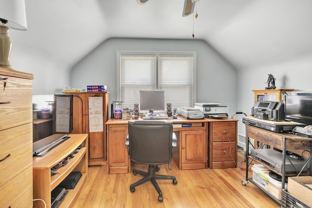 home office featuring vaulted ceiling and light wood-type flooring