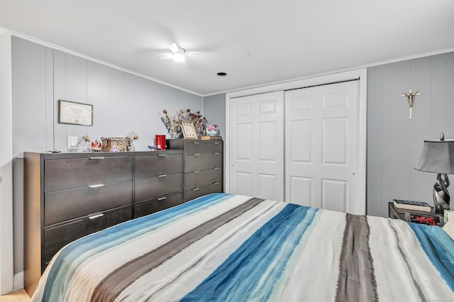 bedroom with a closet, a ceiling fan, and crown molding