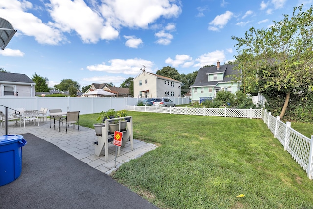 view of yard featuring a fenced backyard and a patio